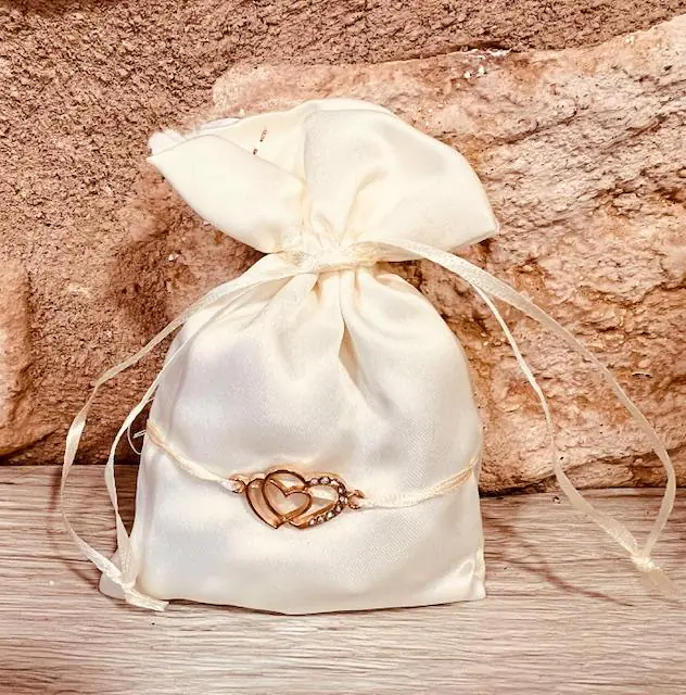 sac ivoire breloque coeurs strass